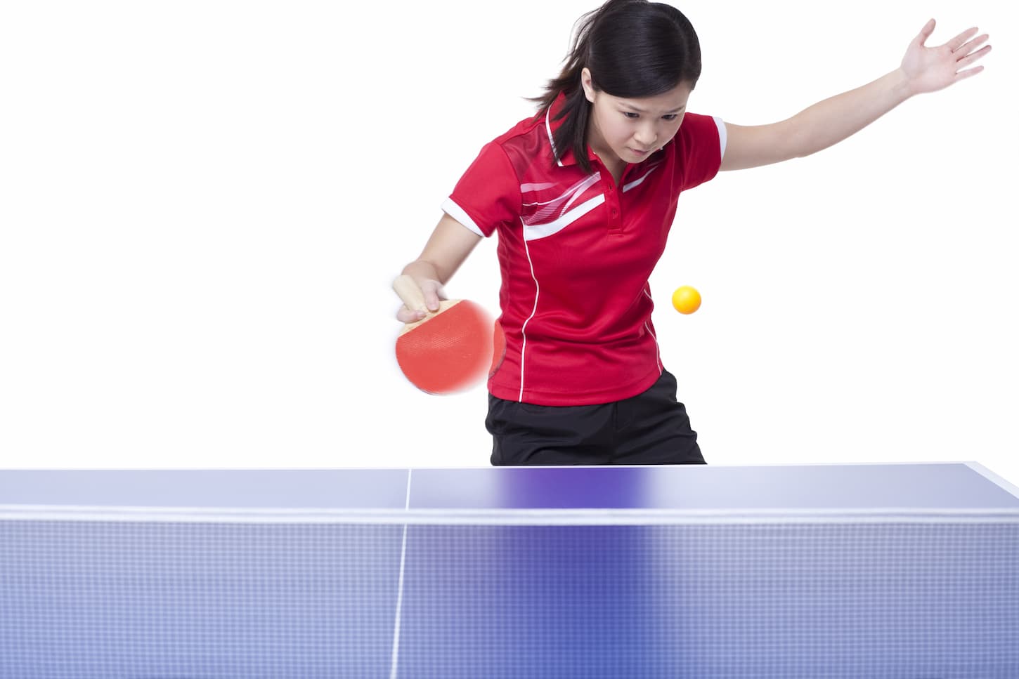 An image of a female athlete playing table tennis.
