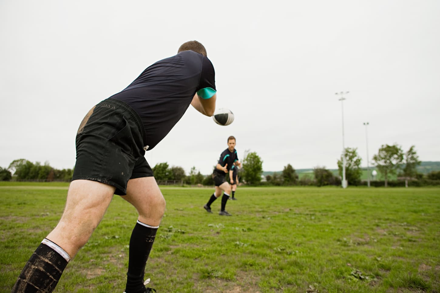 An image of a Rugby game in action. 2 players in the position.