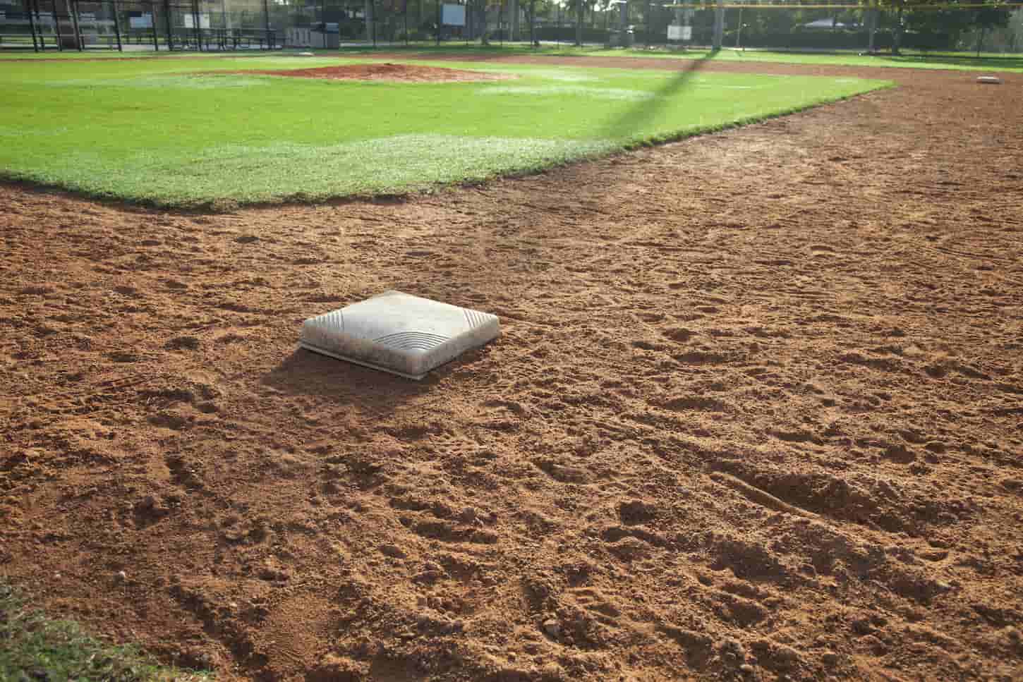 An image of a Baseball Infield in Morning Light on the First Base Side.