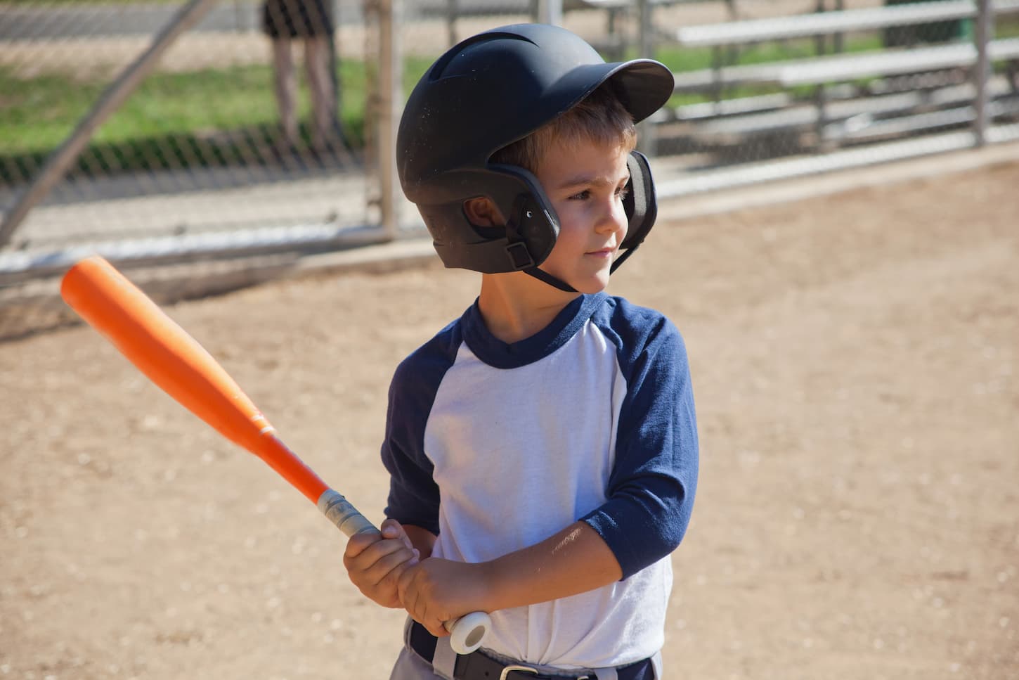 An image of a Little boy playing baseball.